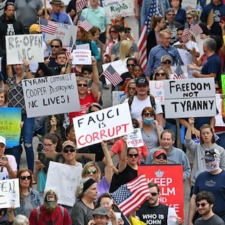 Large group of white racists protesting public health regulations