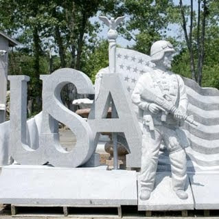 Photograph of Marc and Debra Blain's statue celebrating America's affinity for wars