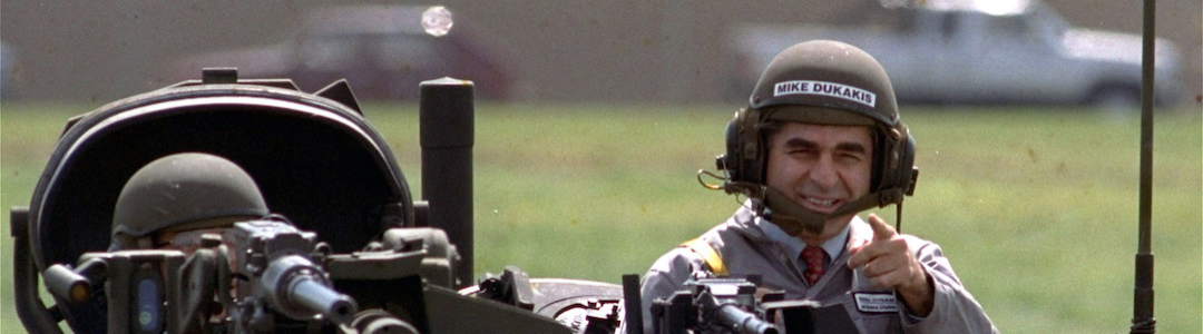 Governor Michael Dukakis drives a tank in 1988