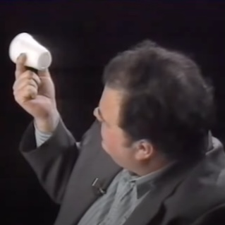 David Thomas examines a cup
